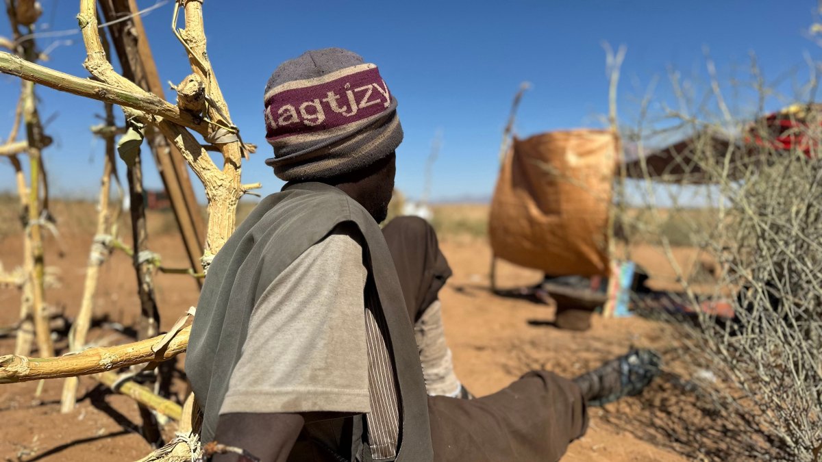 Sudanese displaced Abdullah Idris, who says he was imprisoned and tortured in Rapid Support Forces' (RSF) prisons before fleeing El-Fasher, sits at a makeshift shelter in the town of Tawila, Darfur, Sudan, March 2, 2026. (AFP Photo)