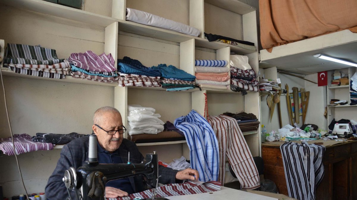 Yaşar Öztemel handcrafts nostalgic striped pajamas in his shop, Manisa, Türkiye, March 27, 2026. (DHA Photo)