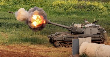 An Israeli self-propelled howitzer artillery gun fires rounds toward southern Lebanon from a position in the upper Galilee, northern Israel, March 26, 2026. (AFP Photo)