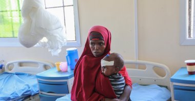 Isho Isak sits with her malnourished child at Dolow Referral Hospital in southern Somalia after being affected by drought, Dolow, Somalia, March 25, 2026 (AP Photo)