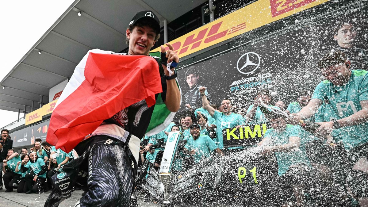 Mercedes' Italian driver Kimi Antonelli celebrates with his team after winning the F1 Japanese GP at the Suzuka circuit in Suzuka, Mie prefecture, Japan, March 29, 2026. (AFP Photo)