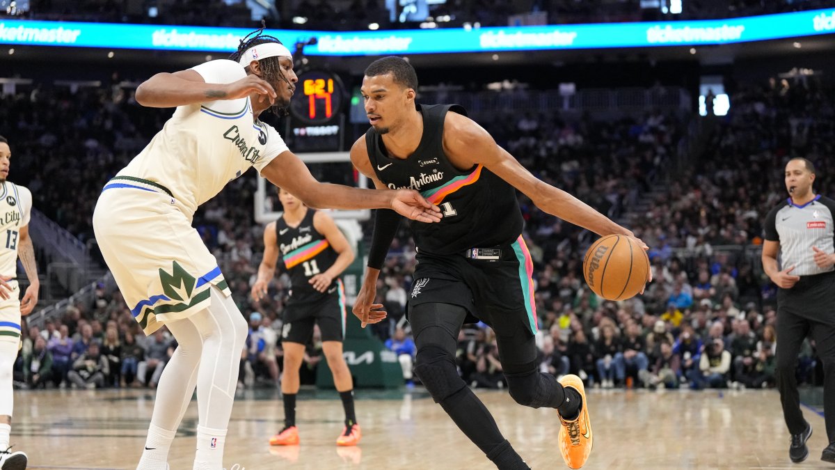 Spurs forward Victor Wembanyama (R) drives toward the basket against Bucks center Myles Turner during an NBA game, Milwaukee, Wisconsin, U.S., March 28, 2026.