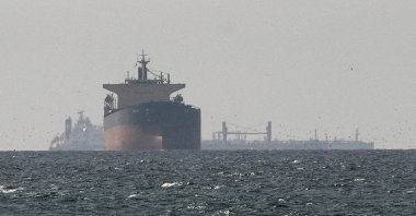 Cargo ships in the Gulf, near the Strait of Hormuz, as seen from northern Ras al-Khaimah, near the border with Oman’s Musandam governate, amid the U.S.-Israeli attacks on Iran, the United Arab Emirates (UAE), March 11, 2026. (Reuters Photo)