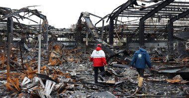 A member of the Iranian Red Crescent stands amid the wreckage of a building destroyed by U.S. and Israeli strikes, in Tehran, Iran, March 28, 2026. (EPA Photo)
