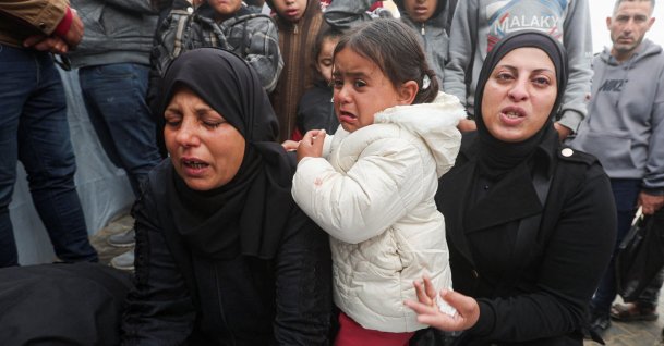 Mourners gather by the body during the funeral of six Palestinians, including three policemen, killed in Israeli strikes, in Khan Younis, southern Gaza Strip, Palestine, March 29, 2026. (Reuters Photo)
