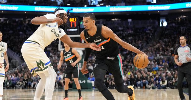 Spurs forward Victor Wembanyama (R) drives toward the basket against Bucks center Myles Turner during an NBA game, Milwaukee, Wisconsin, U.S., March 28, 2026.