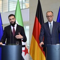 German Chancellor Friedrich Merz and Syrian President Ahmed al-Sharaa address a joint press conference after talks at the Chancellery in Berlin on March 30, 2026. (AFP Photo)