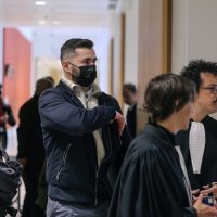 Defendant French military member Carl Esnault (C) and his lawyer Romain Ruiz (2nd R) arrive for the opening of the so-called Athanor trial, in which 22 people are facing a wide range of charges, including murder, centred on the Athanor Masonic lodge accused of running hit squads, at the Assize Court in the Tribunal Judiciaire courthouse in Paris, March 30, 2026. (AFP Photo)