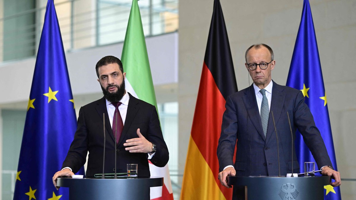 German Chancellor Friedrich Merz and Syrian President Ahmed al-Sharaa address a joint press conference after talks at the Chancellery in Berlin on March 30, 2026. (AFP Photo)