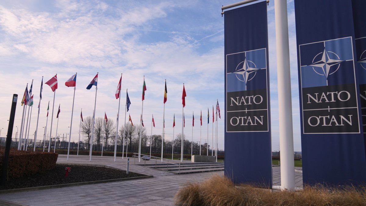 Flags flap in the wind outside NATO headquarters in Brussels, Monday, Jan. 19, 2026. (AP File Photo)