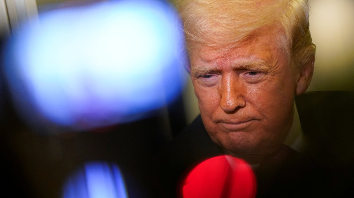 U.S. President Donald Trump looks on as he speaks to members of the media aboard Air Force One en route to Joint Base Andrews, Maryland, U.S., March 29, 2026. (Reuters Photo)
