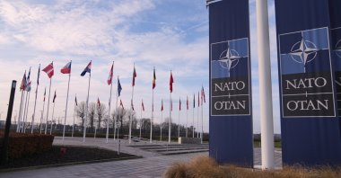 Flags flap in the wind outside NATO headquarters in Brussels, Monday, Jan. 19, 2026. (AP File Photo)