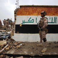 Iraqi soldiers inspect the site of a destroyed healthcare center in the Habbaniyah military base, which was targeted by in an airstrike killing seven security personnel and wounding 13 others, in Habbaniyah, west of Baghdad, Iraq, March 26, 2026. (AFP Photo)