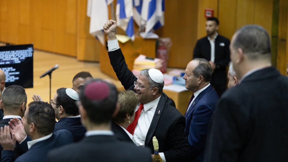 Israel's Minister of National Security, Itamar Ben-Gvir (C) and lawmakers celebrate after Israel's parliament passed a law approving the death penalty for Palestinians convicted of murdering Israelis, at the Knesset in west Jerusalem, March 30, 2026. (AP Photo)