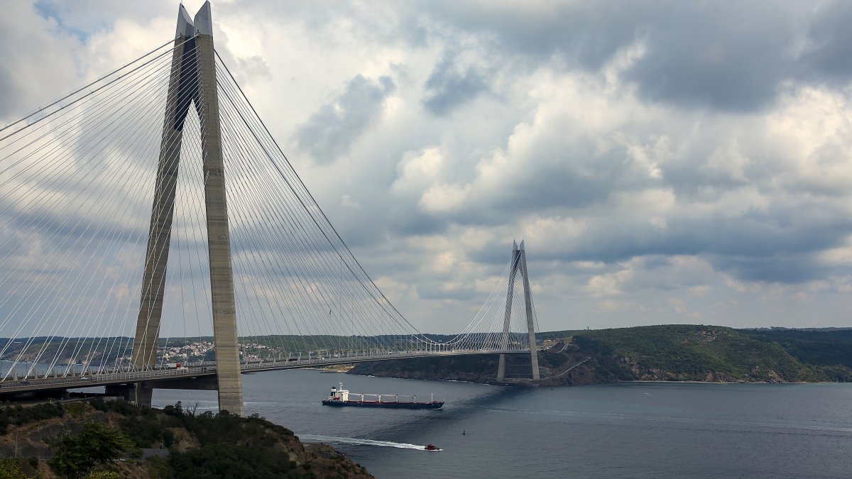 The Sierra Leone-flagged cargo ship Razoni sails under Yavuz Sultan Selim Bridge at the entrance of the Bosphorus Strait in Istanbul, Türkiye, Aug. 3, 2022. (AP Photo)