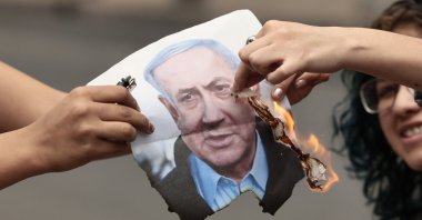 People burn an image of Israeli Prime Minister Benjamin Netanyahu during a demonstration in front of the Angel de la Independencia monument, Mexico City, Mexico, March 14, 2026. (EPA Photo)
