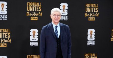 Arsene Wenger poses for photo as he arrives on the red carpet for a welcome reception ahead of the draw for 2026 FIFA World Cup at the Kennedy Center, Washington, U.S., Dec. 4, 2025. (AP Photo)