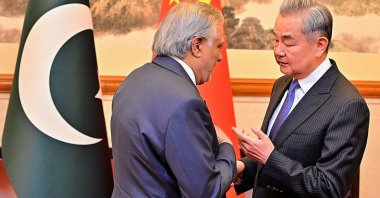 China's Foreign Minister Wang Yi (R) speaking with his Pakistani counterpart Ishaq Dar in Beijing, China, March 31, 2026. (AFP Photo)