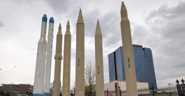 Mockups of domestically-made Iranian missiles are displayed at an exhibition outside the Defense Museum in Tehran, Iran, March 31, 2026. (AFP Photo)