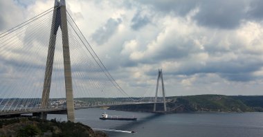 The Sierra Leone-flagged cargo ship Razoni sails under Yavuz Sultan Selim Bridge at the entrance of the Bosphorus Strait in Istanbul, Türkiye, Aug. 3, 2022. (AP Photo)