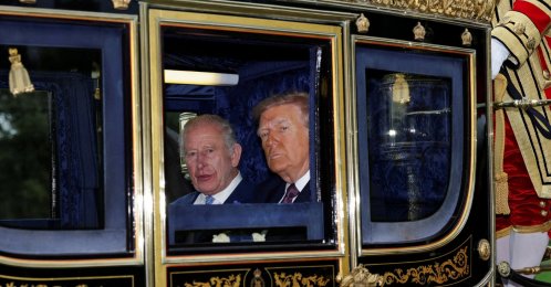 Britain's King Charles and U.S. President Donald Trump sit in a carriage during a procession through Windsor Castle, in Windsor, Britain, Sept. 17, 2025. (Reuters Photo)