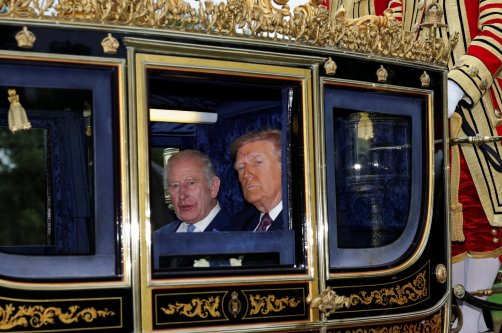 Britain's King Charles and U.S. President Donald Trump sit in a carriage during a procession through Windsor Castle, in Windsor, Britain, Sept. 17, 2025. (Reuters Photo)