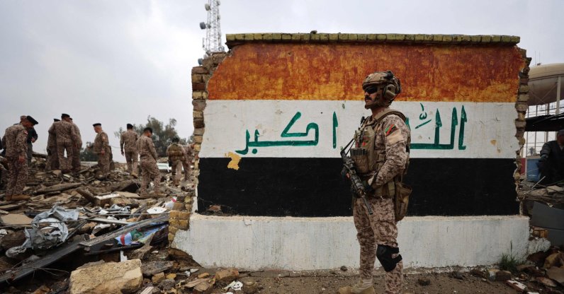 Iraqi soldiers inspect the site of a destroyed healthcare center in the Habbaniyah military base, which was targeted by in an airstrike killing seven security personnel and wounding 13 others, in Habbaniyah, west of Baghdad, Iraq, March 26, 2026. (AFP Photo)