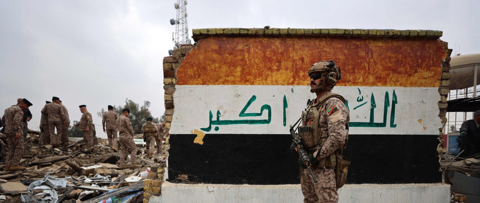 Iraqi soldiers inspect the site of a destroyed healthcare center in the Habbaniyah military base, which was targeted by in an airstrike killing seven security personnel and wounding 13 others, in Habbaniyah, west of Baghdad, Iraq, March 26, 2026. (AFP Photo)