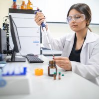 A female researcher wearing protective goggles uses a micropipette to handle liquid samples in a laboratory, Istanbul, Türkiye, April 12, 2023. (Shutterstock Photo) 