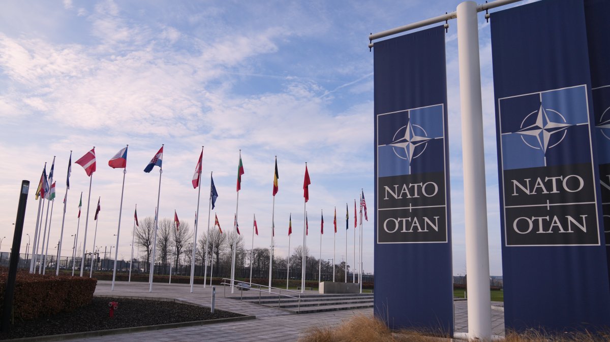 Flags flap in the wind outside NATO headquarters in Brussels, Belgium, Jan. 19, 2026. (AP Photo)