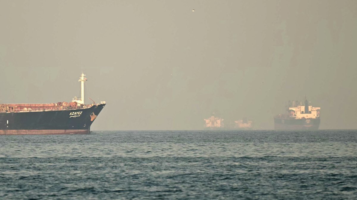 Cargo ships and tankers are seen off coast city of Fujairah in the Strait of Hormuz in the northern Emirate, Feb. 25, 2026. (AFP Photo)