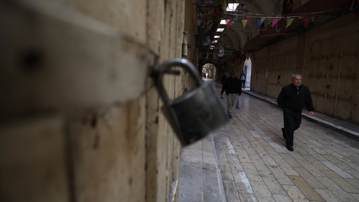 A Palestinian man walks along an empty street during a general strike in Nablus, Israel-occupied West Bank, Palestine, April 2026. (EPA Photo)