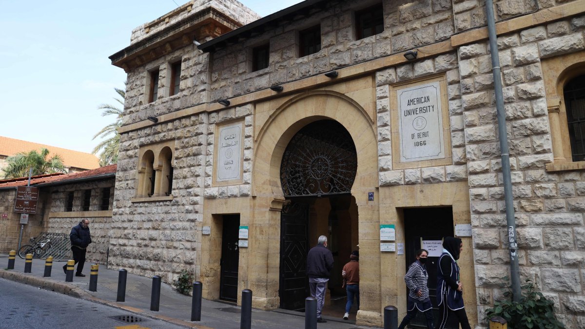 People walk past the main gate of the campus of the American University of Beirut (AUB) in the center of Beirut, Jan. 13, 2022. (AFP File Photo)