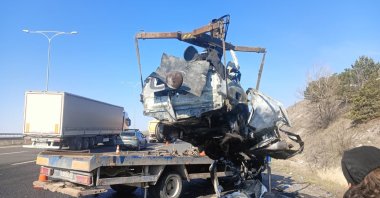 Emergency teams remove the burned car from the street, Ankara, Türkiye, April 1, 2026. (IHA Photo)