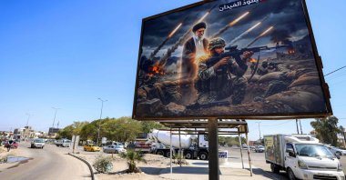 A billboard depicting Ayatollah Ali Khamenei, Iran's late supreme leader who was killed in a U.S.-Israeli strike in Tehran, is displayed along a road in the Ameriyah neighborhood, Baghdad, Iraq, March 18, 2026. (AFP Photo)