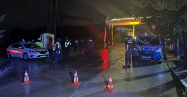 Security officers wait outside a venue owned by the Uşak mayor during a search of premises for investigation, Uşak, western Türkiye, March 30, 2026. (AA Photo)
