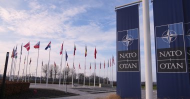 Flags flap in the wind outside NATO headquarters in Brussels, Belgium, Jan. 19, 2026. (AP Photo)