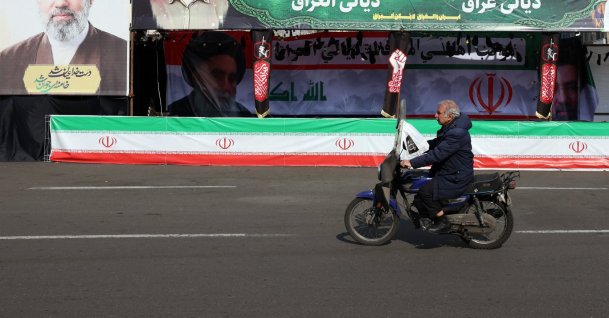 A man drives a motorcycle past billboards of Iranian Supreme Leader Ayatollah Mojtaba Khamenei in a street in Tehran, Iran, March 31, 2026. (EPA Photo)