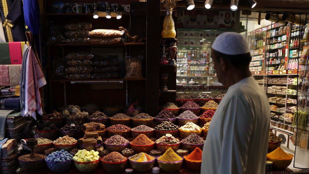 A shopper inspects food items at Dubai old souk (market), in preparation for the Muslim holy month of Ramadan, in Dubai, United Arab Emirates, March 21, 2023. (EPA File Photo)