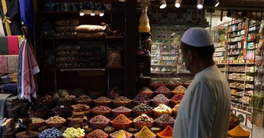A shopper inspects food items at Dubai old souk (market), in preparation for the Muslim holy month of Ramadan, in Dubai, United Arab Emirates, March 21, 2023. (EPA File Photo)