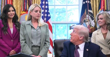 U.S. Secretary of Homeland Security Kristi Noem (L) and U.S. Attorney General Pam Bondi (2nd L) listen as President Donald Trump speaks before signing an order sending National Guard troops to Memphis, Washington, D.C., U.S., Sept. 15, 2025. (AFP Photo)