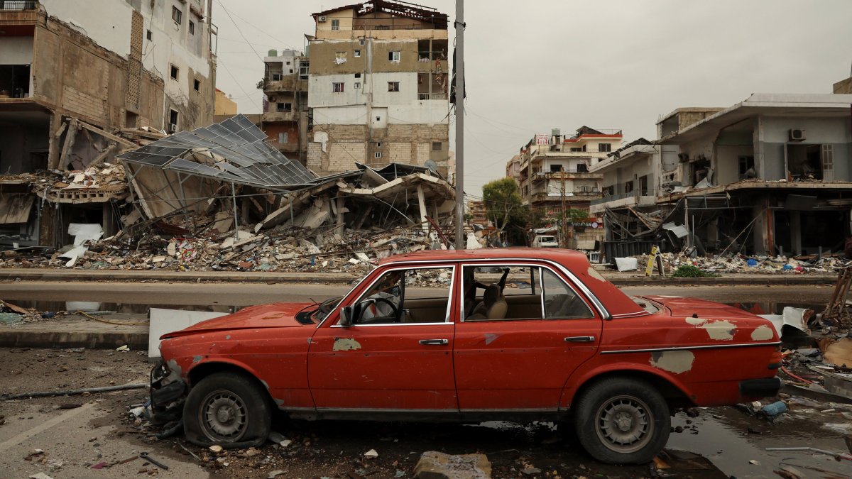 A car damaged in front of the rubble of a building destroyed by an Israeli strike as the U.S.-Israeli attacks on Iran continue, Tyre, Lebanon, April 2, 2026. (Reuters Photo)