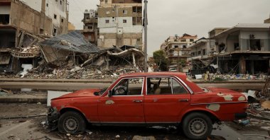 A car damaged in front of the rubble of a building destroyed by an Israeli strike as the U.S.-Israeli attacks on Iran continue, Tyre, Lebanon, April 2, 2026. (Reuters Photo)