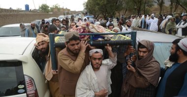 Mourners carry a deceased during a burial ceremony for victims who died in flash floods, Kandahar, Afghanistan, April 2, 2026. (AFP Photo)