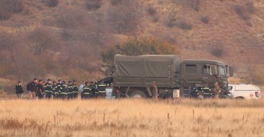 Members of emergency services work at the site of the Turkish C-130 military cargo plane crash near the Azerbaijani border, Sighnaghi municipality, Georgia, Nov. 12, 2025. (Reuters Photo)