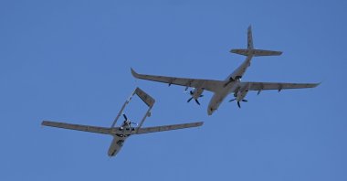 The Bayraktar TB2 (bottom) and Akıncı combat drones fly over Edirne, northwestern Türkiye, March 26, 2026. (AA Photo)
