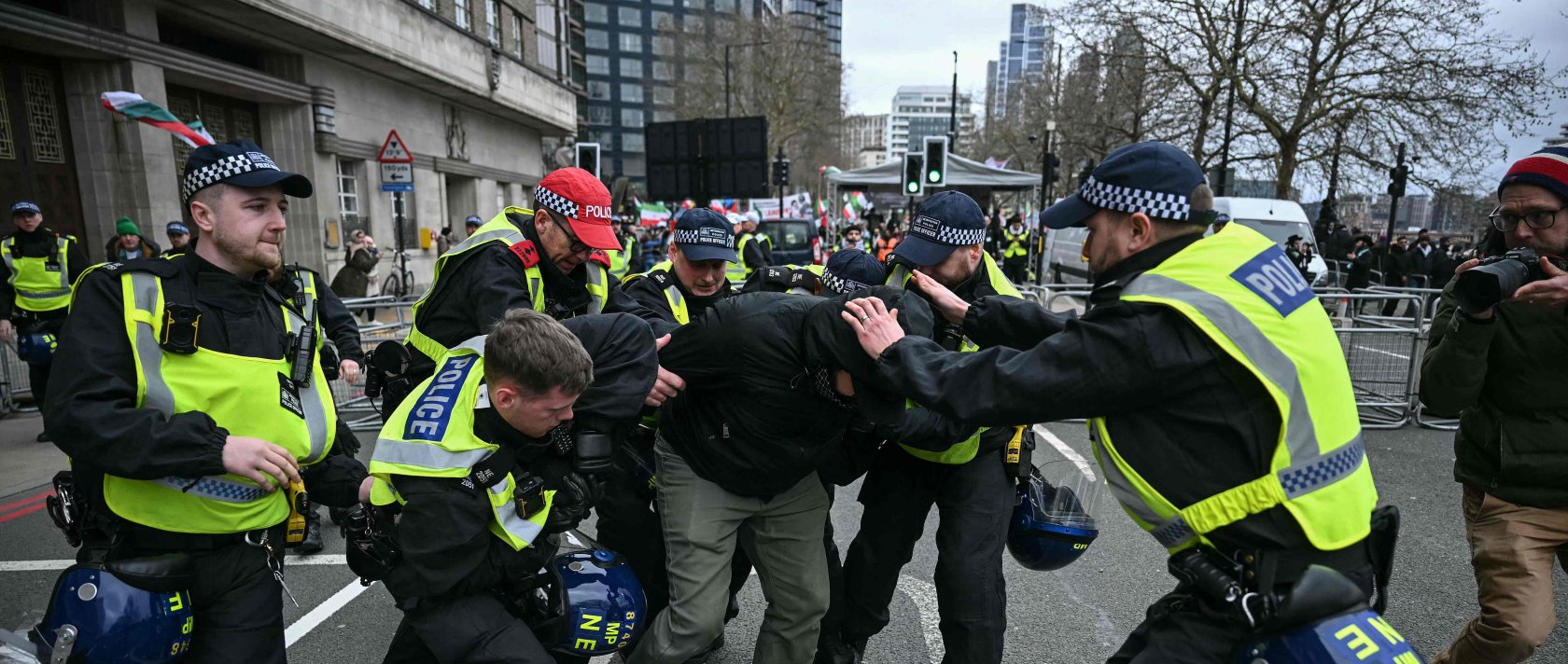 Police arrest a protester (C-in black) for not removing a face covering during an annual protest held by pro-Palestinian group Al-Quds, central London, U.K., March 15, 2026. (AFP Photo)