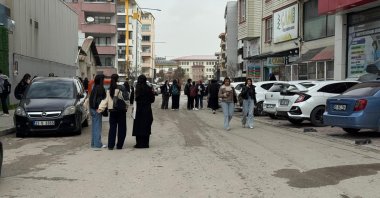 People gather in the street following a magnitude 5.2 earthquake in eastern Van province, Türkiye, April 4, 2026. (AA Photo)