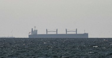 A cargo ship in the Gulf, near the Strait of Hormuz, as seen from northern Ras al-Khaimah, near the border with Oman’s Musandam governance, amid the U.S.-Israeli conflict with Iran, in United Arab Emirates, March 11, 2026. (Reuters Photo)