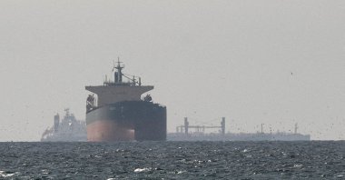 Cargo ships in the Gulf, near the Strait of Hormuz, as seen from northern Ras al-Khaimah, near the border with Oman’s Musandam governance, amid the U.S.-Israeli conflict with Iran, in United Arab Emirates, March 11, 2026. (Reuters Photo)